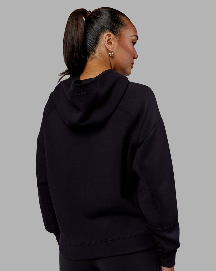 Woman wearing Elevate SoftTouch Zip Through Hoodie - Black-Black
