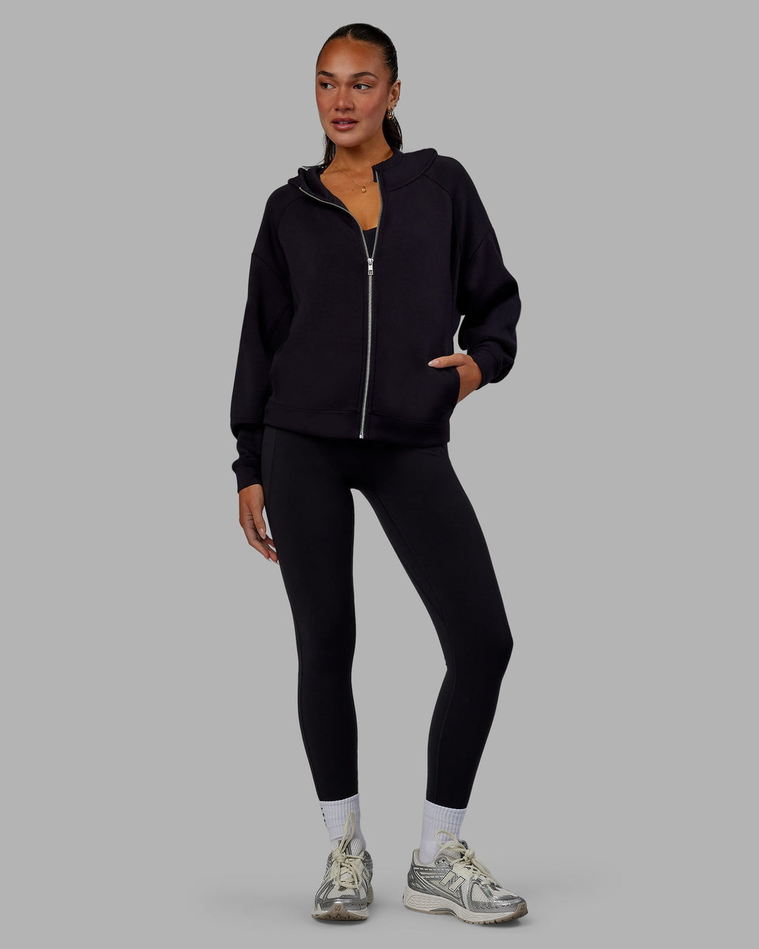 Woman wearing Elevate SoftTouch Zip Through Hoodie - Black-Black