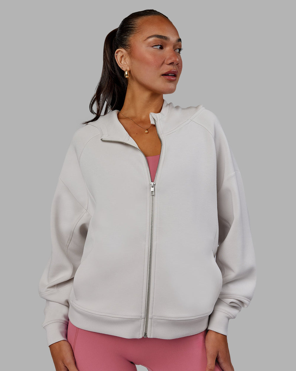 Woman wearing Elevate SoftTouch Zip Through Hoodie - Clay-Clay