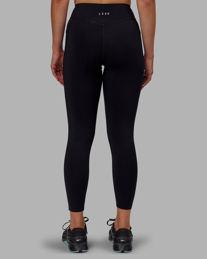 Woman wearing Elite 7/8 Length Leggings - Black
