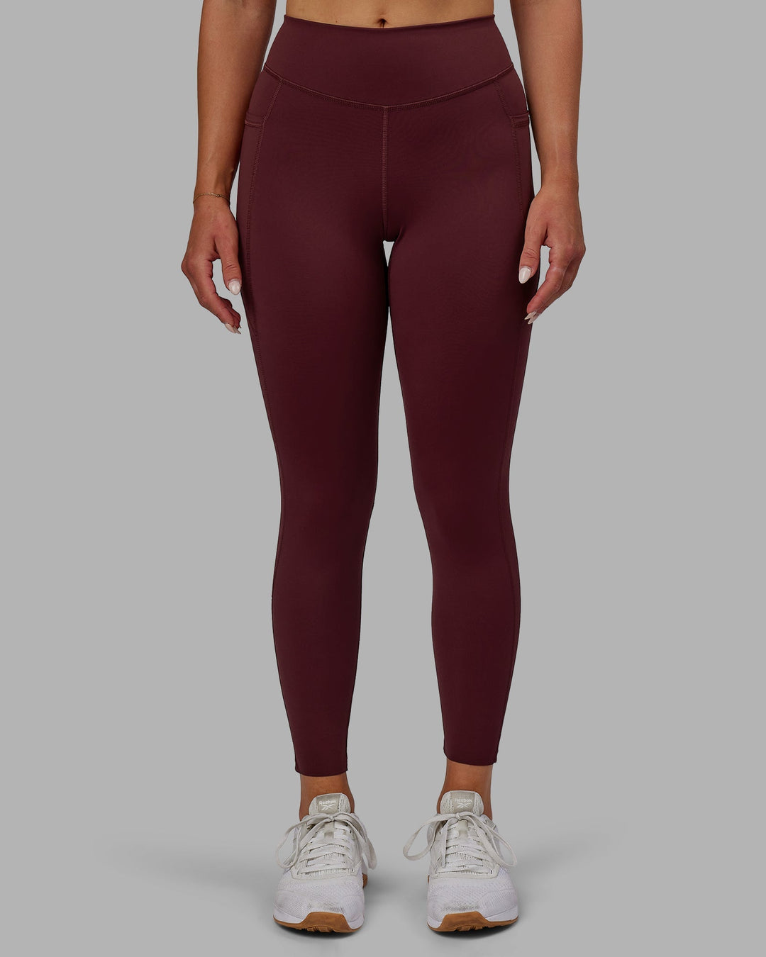 Woman wearing Elite 7/8 Length Leggings - Dark Cherry