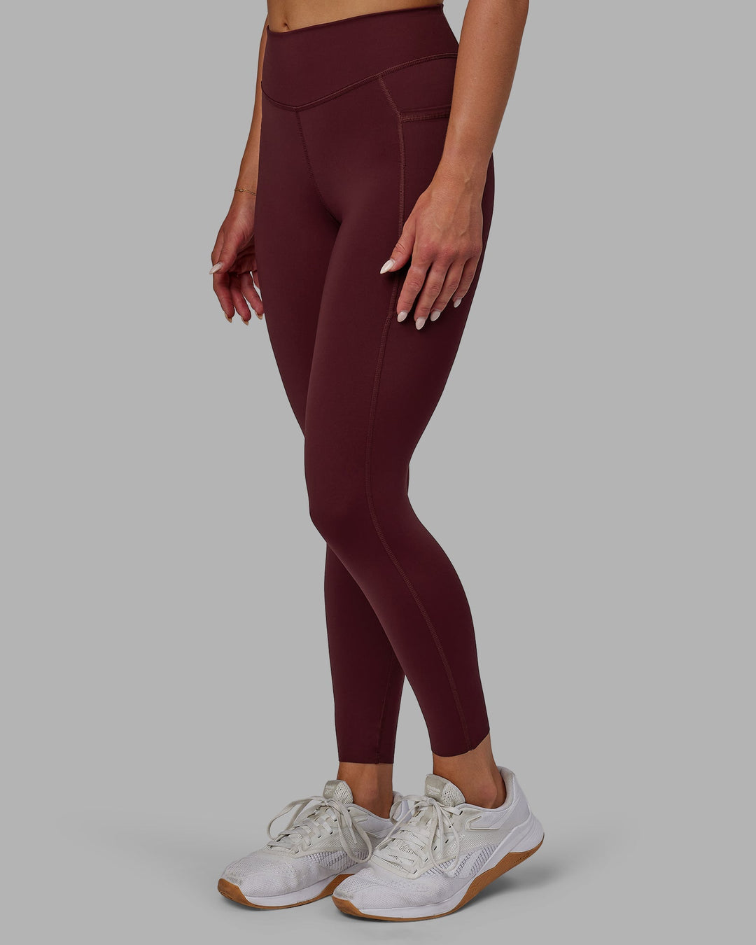 Woman wearing Elite 7/8 Length Leggings - Dark Cherry