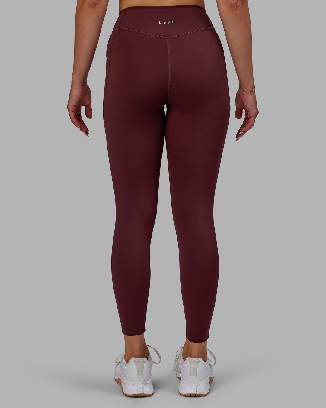 Woman wearing Elite 7/8 Length Leggings - Dark Cherry