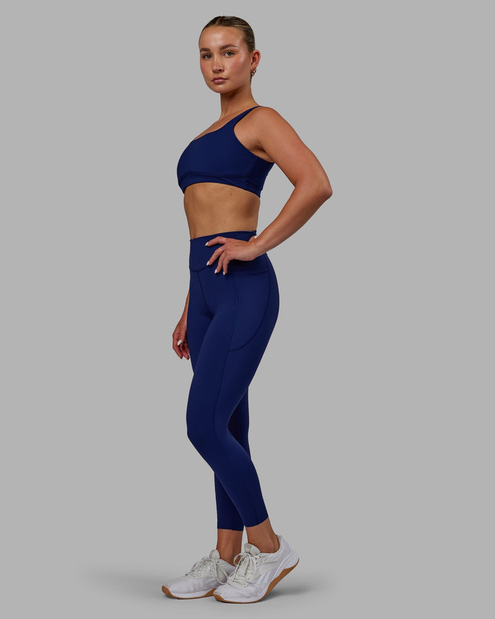 Woman wearing Elite 7/8 Length Leggings - Midnight Blue
