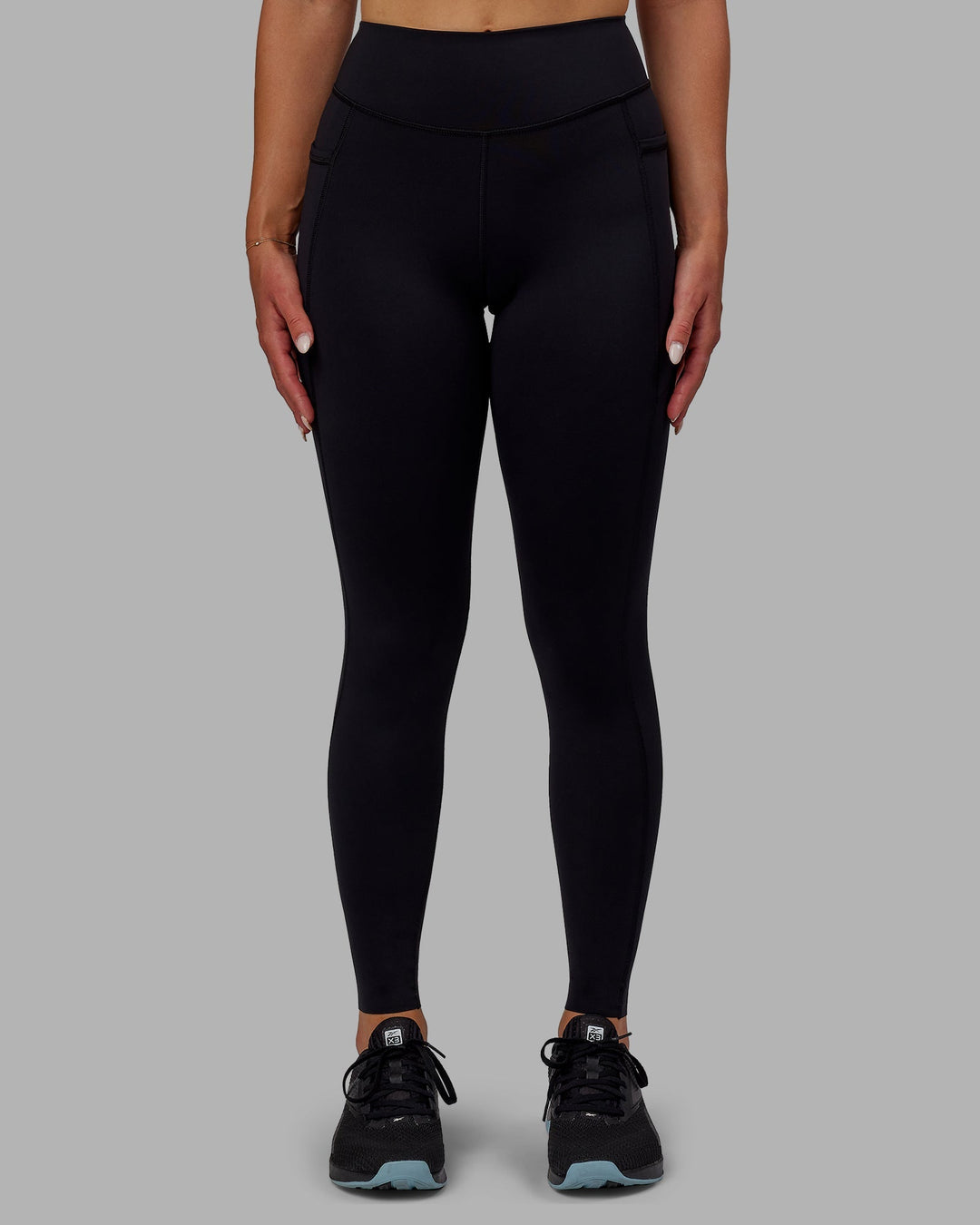 Woman wearing Elite Full Length Leggings - Black