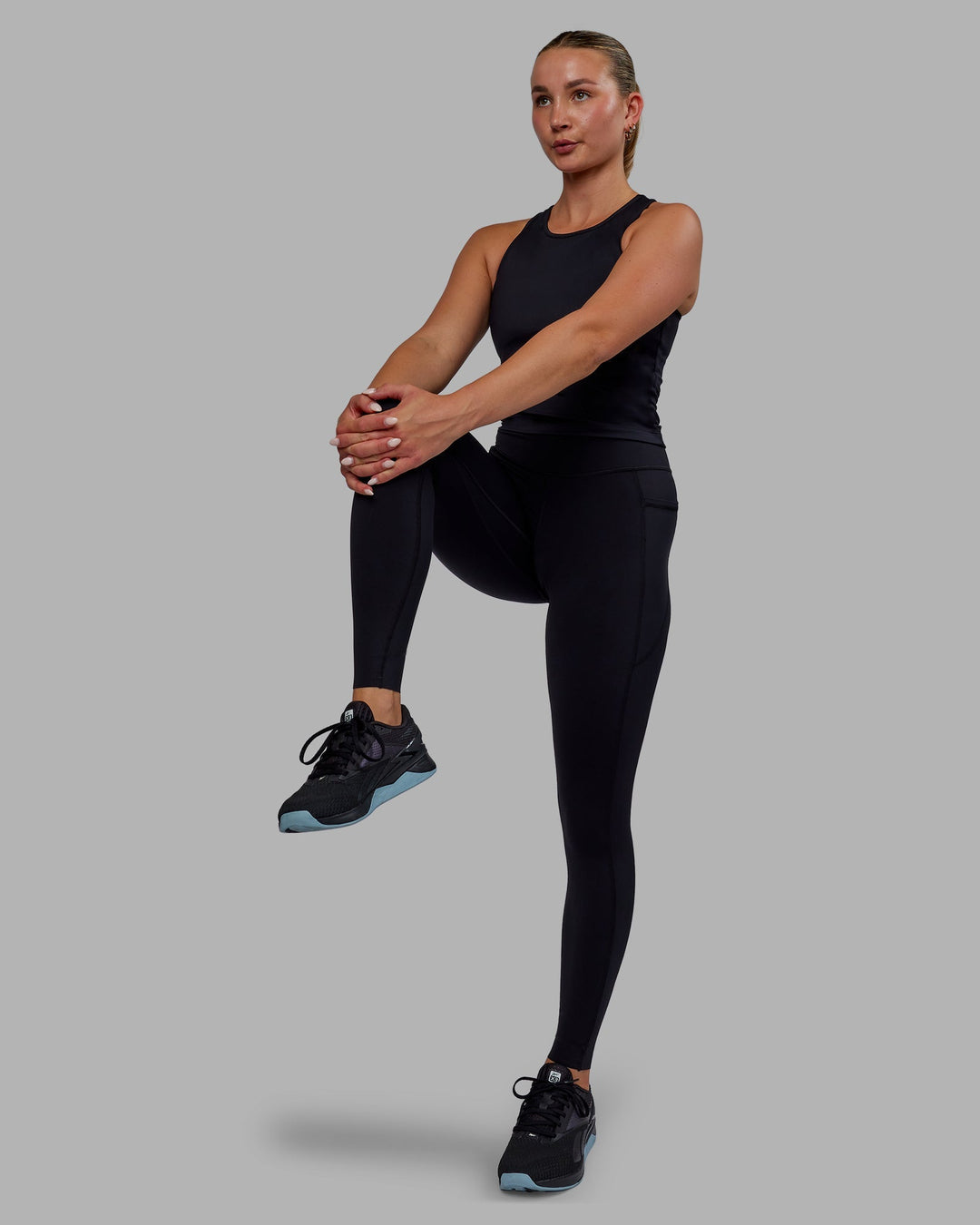 Woman wearing Elite Full Length Leggings - Black