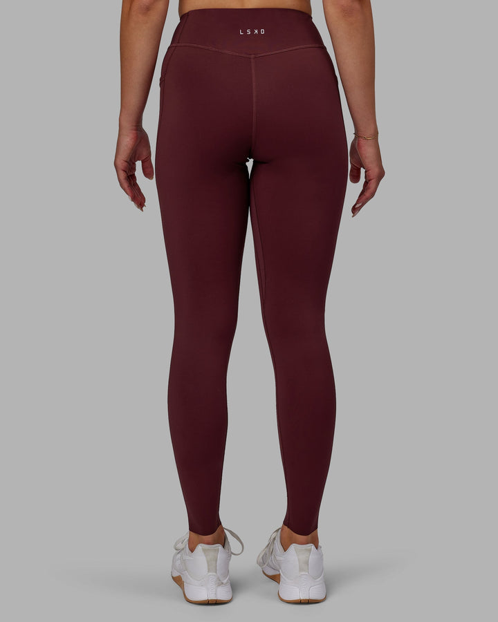 Woman wearing Elite Full Length Leggings - Dark Cherry
