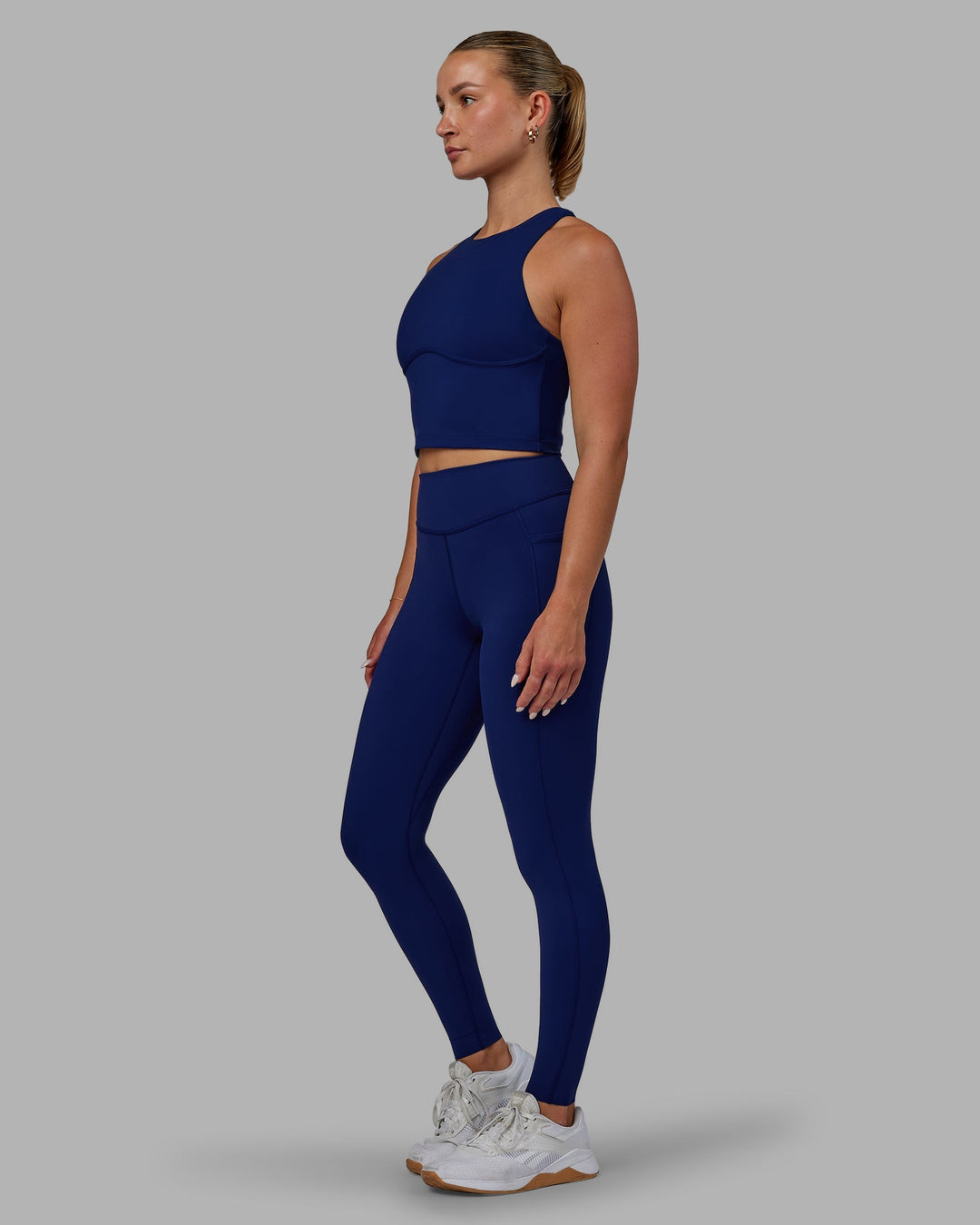 Woman wearing Elite Full Length Leggings - Midnight Blue