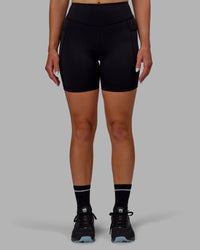 Woman wearing Elite High-Rise 6" Short Pockets - Black