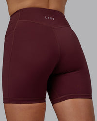 Woman wearing Elite High-Rise 6" Short Pockets - Dark Cherry
