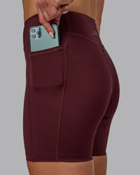 Woman wearing Elite High-Rise 6" Short Pockets - Dark Cherry
