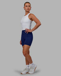 Woman wearing Elite High-Rise 6" Short Pockets - Midnight Blue