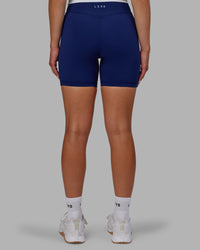 Woman wearing Elite High-Rise 6" Short Pockets - Midnight Blue