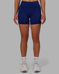 Woman wearing Elite High-Rise 4" Short Pockets - Midnight Blue