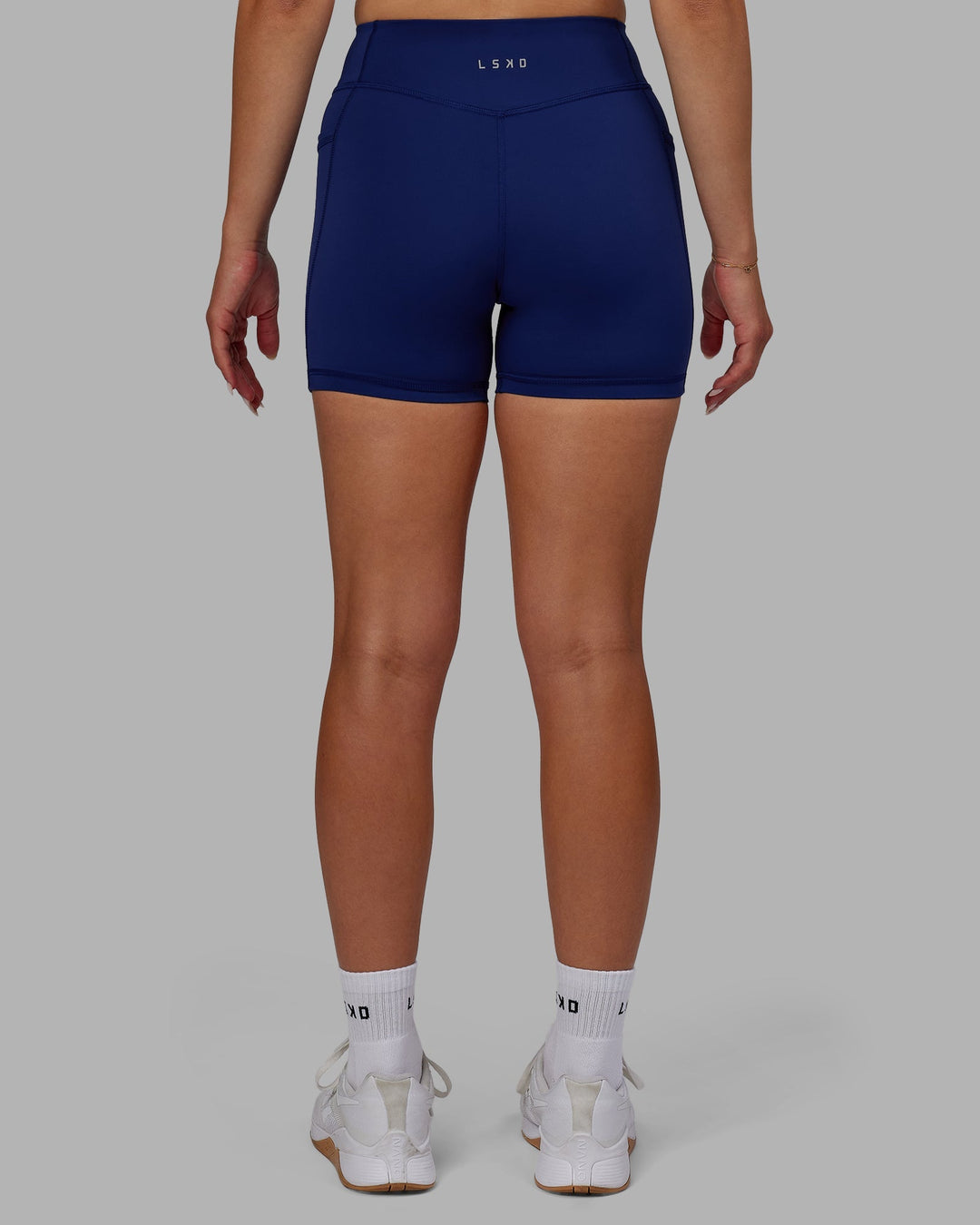 Woman wearing Elite X-Length Shorts - Midnight Blue