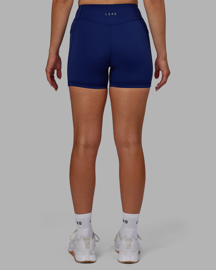 Woman wearing Elite X-Length Shorts - Midnight Blue
