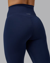 Woman wearing Elixir Ultra High-Rise 7/8 Legging - Future Navy