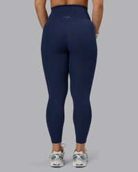 Woman wearing Elixir Ultra High-Rise 7/8 Legging - Future Navy