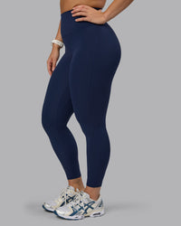 Woman wearing Elixir Ultra High-Rise 7/8 Legging - Future Navy