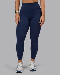Woman wearing Elixir Ultra High-Rise 7/8 Legging - Future Navy