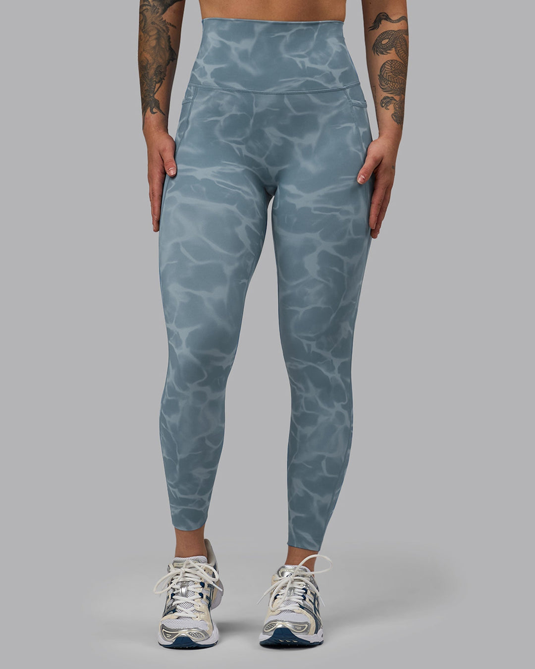 Woman wearing Elixir 7/8 Length Leggings With Pockets - Tranquil-Elemental Blue