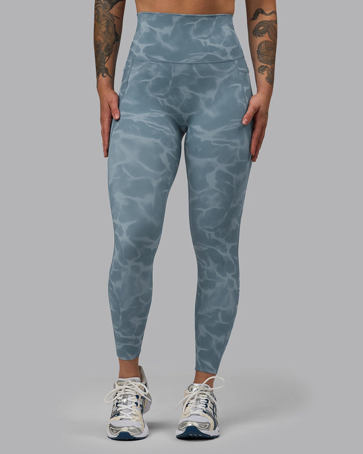 Woman wearing Elixir 7/8 Length Leggings With Pockets - Tranquil-Elemental Blue
