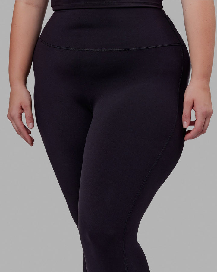 Woman wearing Elixir Full Length Tight - Black No Logo
