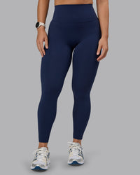 Woman wearing Elixir Ultra High-Rise Full Length Leggings - Future Navy | Thumbnail Index: 1