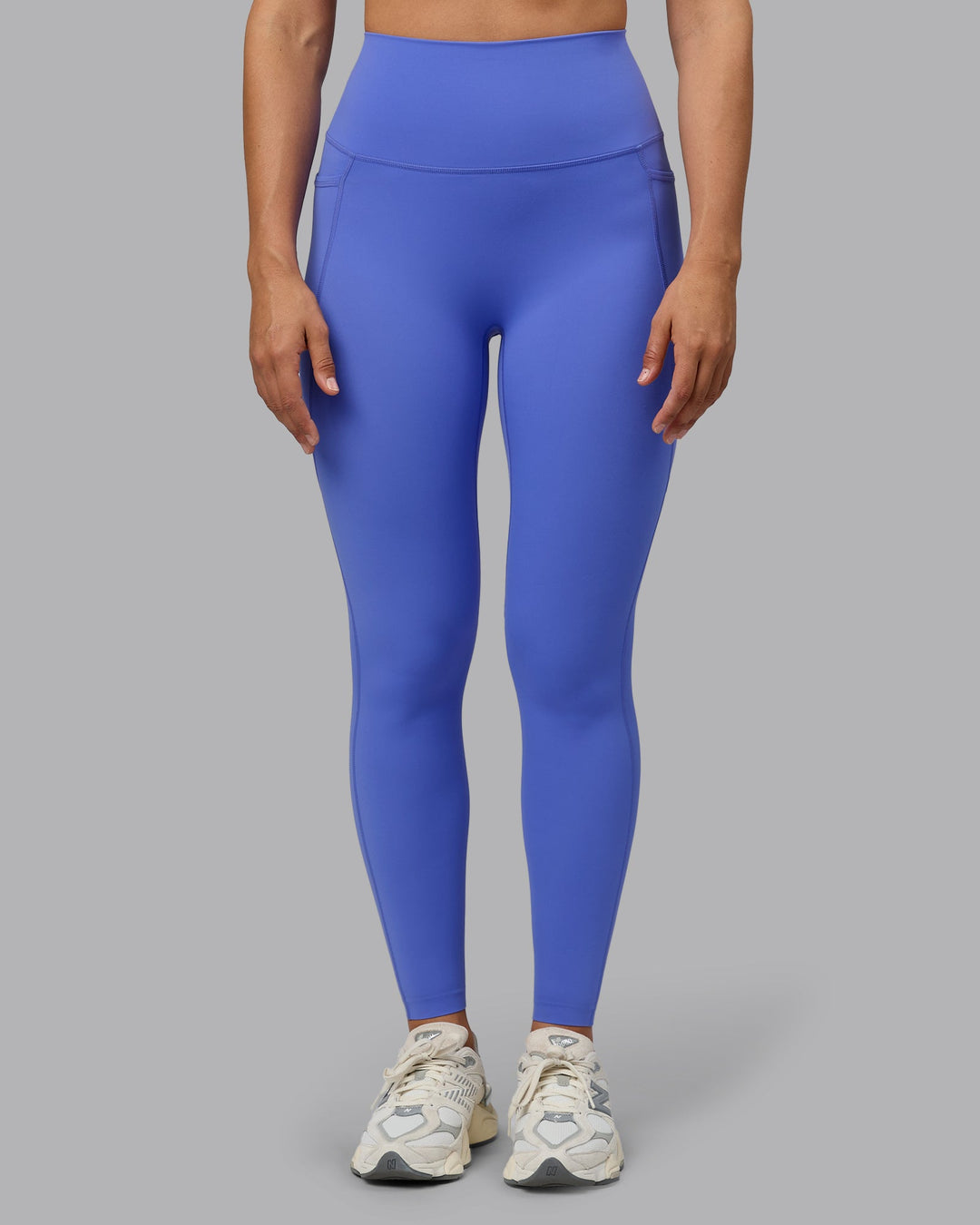 Woman wearing Elixir Full Length Tights With Pockets - Baja Blue