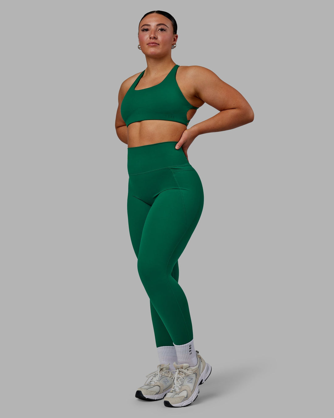 Woman wearing Elixir Full Length Leggings With Pockets - Malachite