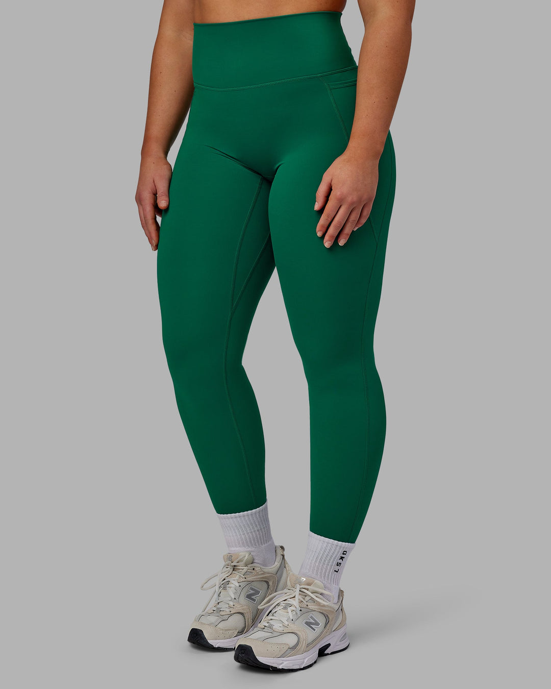 Woman wearing Elixir Full Length Leggings With Pockets - Malachite