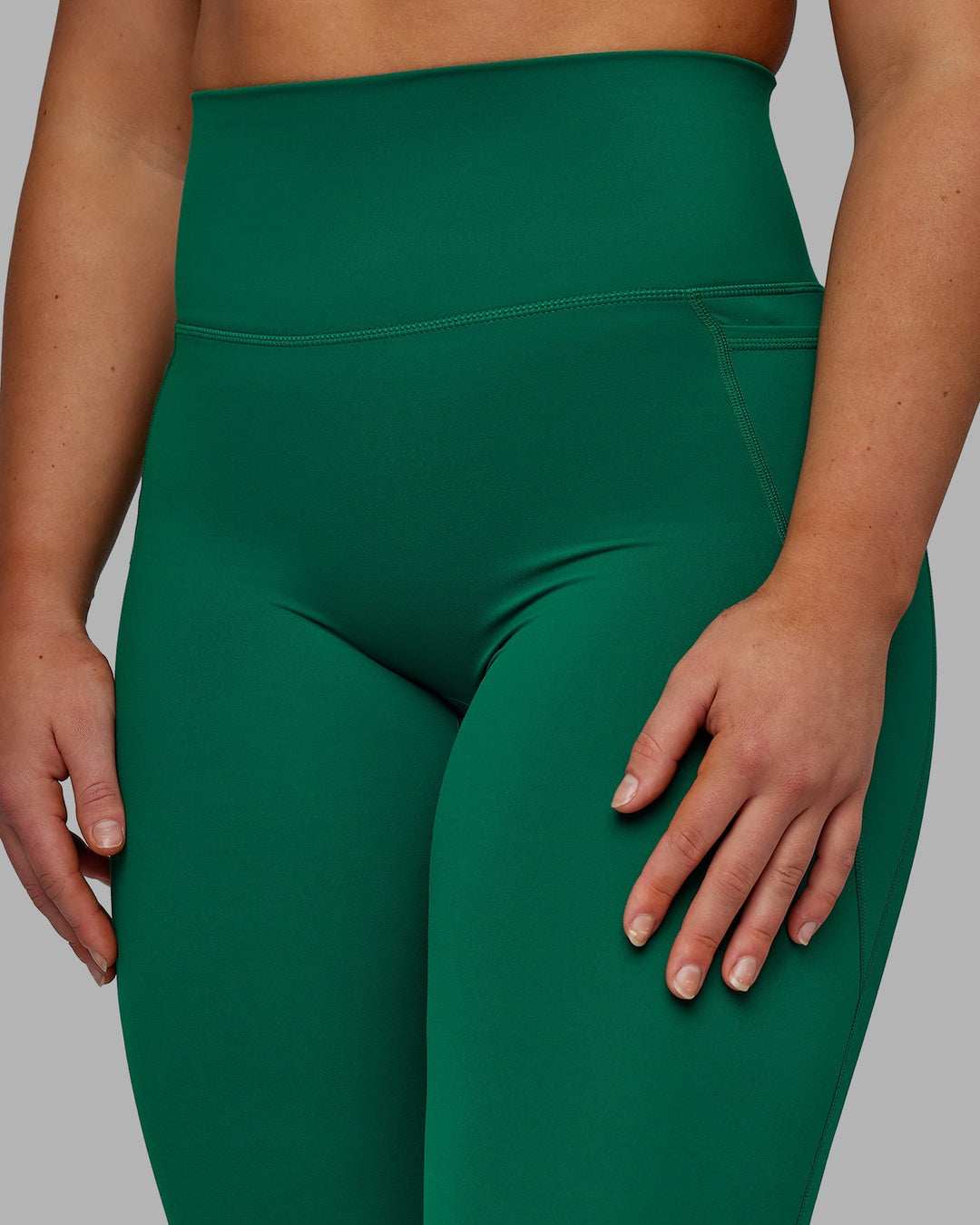 Woman wearing Elixir Full Length Leggings With Pockets - Malachite