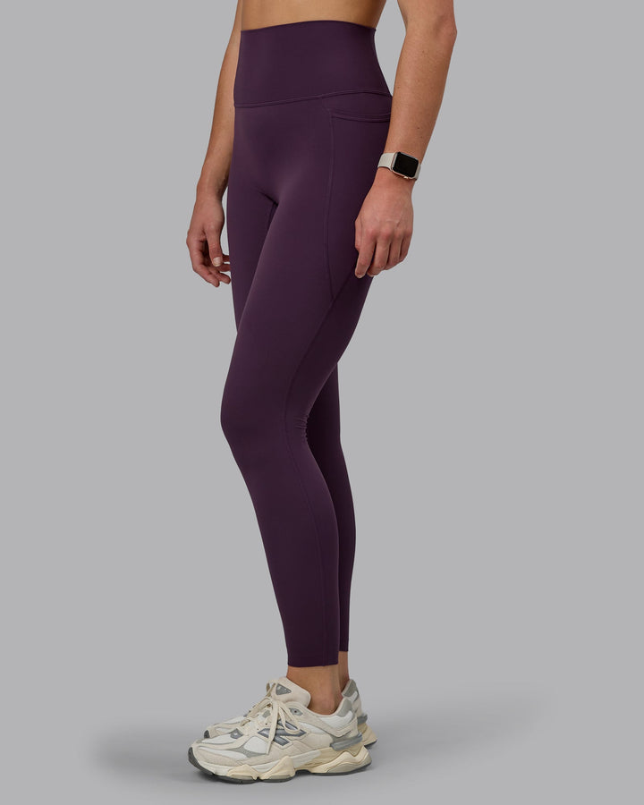 Woman wearing Elixir Full Length Tights With Pockets - Midnight Plum
