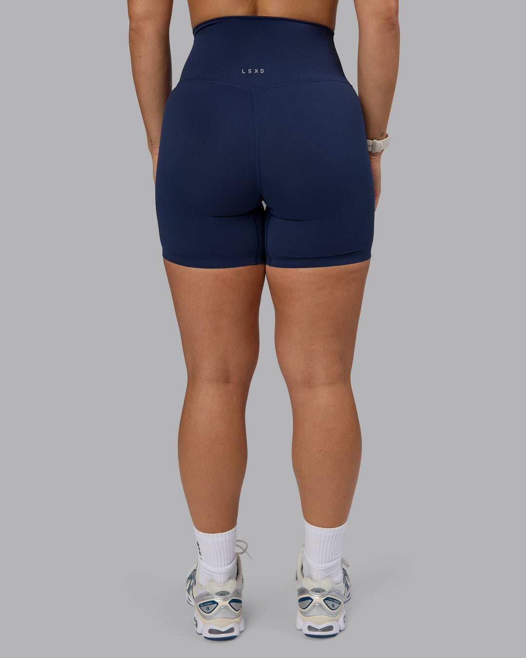 Woman wearing Elixir Mid Short Tights - Future Navy