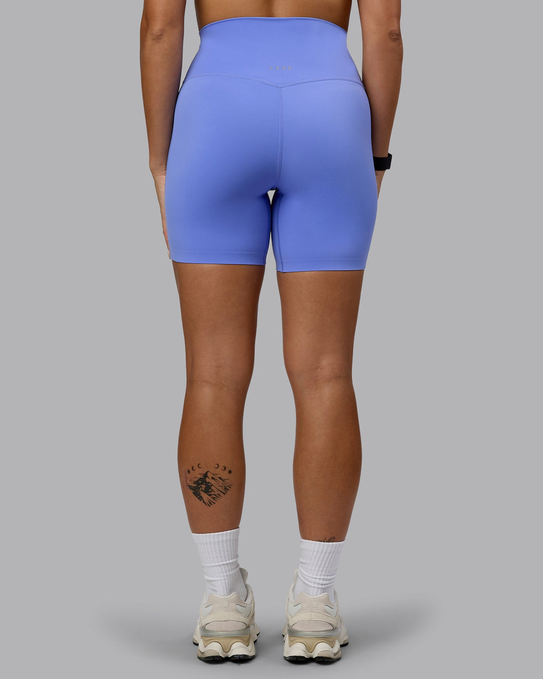 Woman wearing Elixir Mid Short Tights - Indulgent Blue