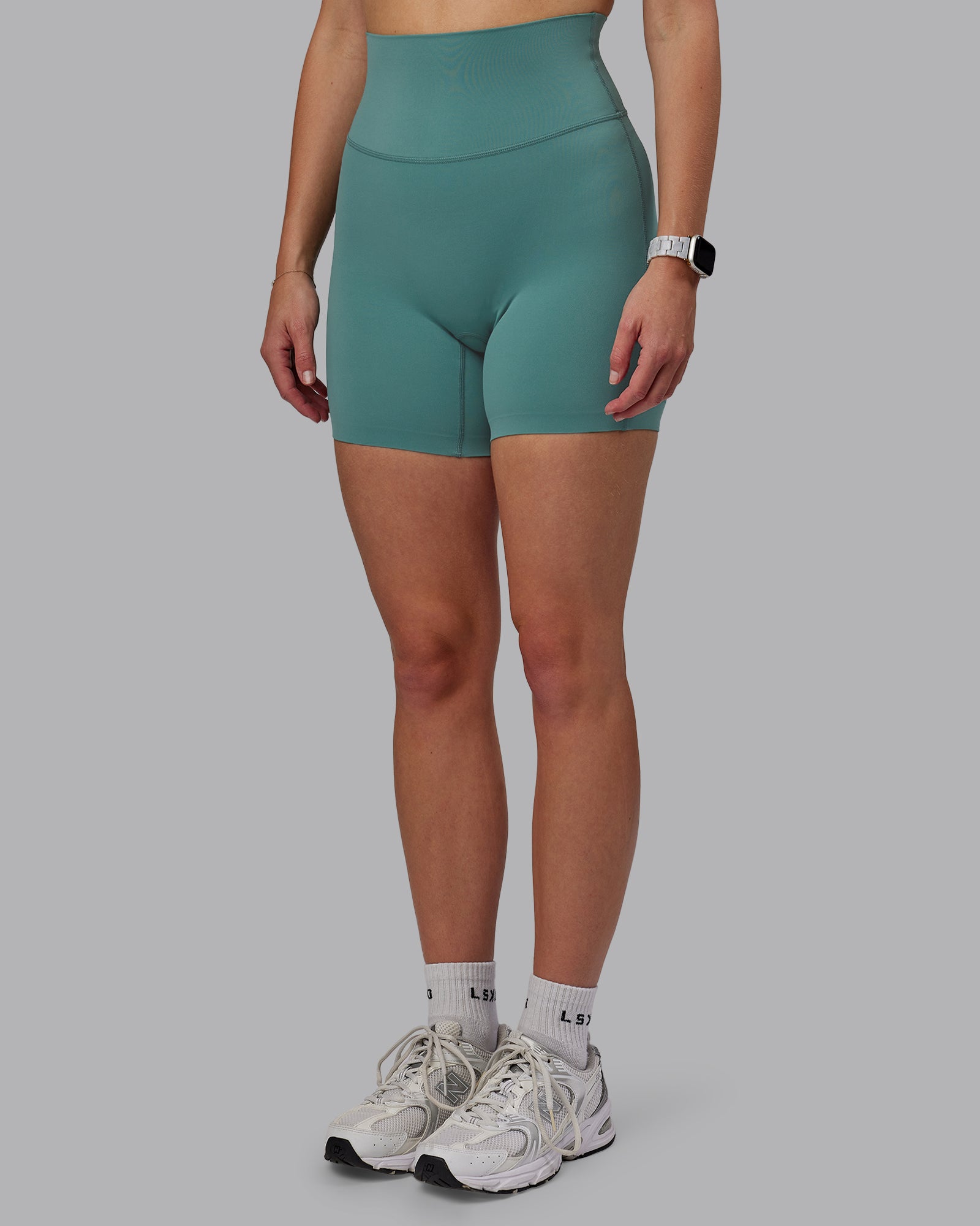 Woman wearing Elixir Ultra High-Rise 6" Short - Sagebrush