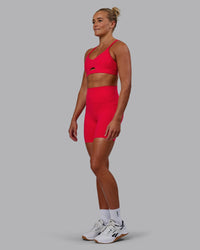 Woman wearing Elixir Ultra High-Rise 6" Short Pockets - Scarlet