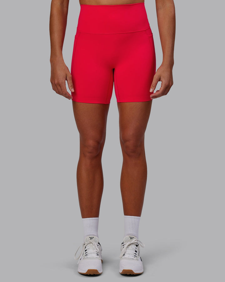 Woman wearing Elixir Mid-Length Shorts with Pockets - Scarlet
