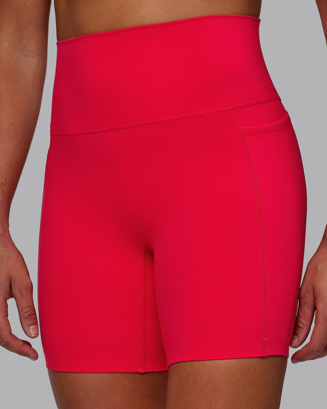 Woman wearing Elixir Mid-Length Shorts with Pockets - Scarlet