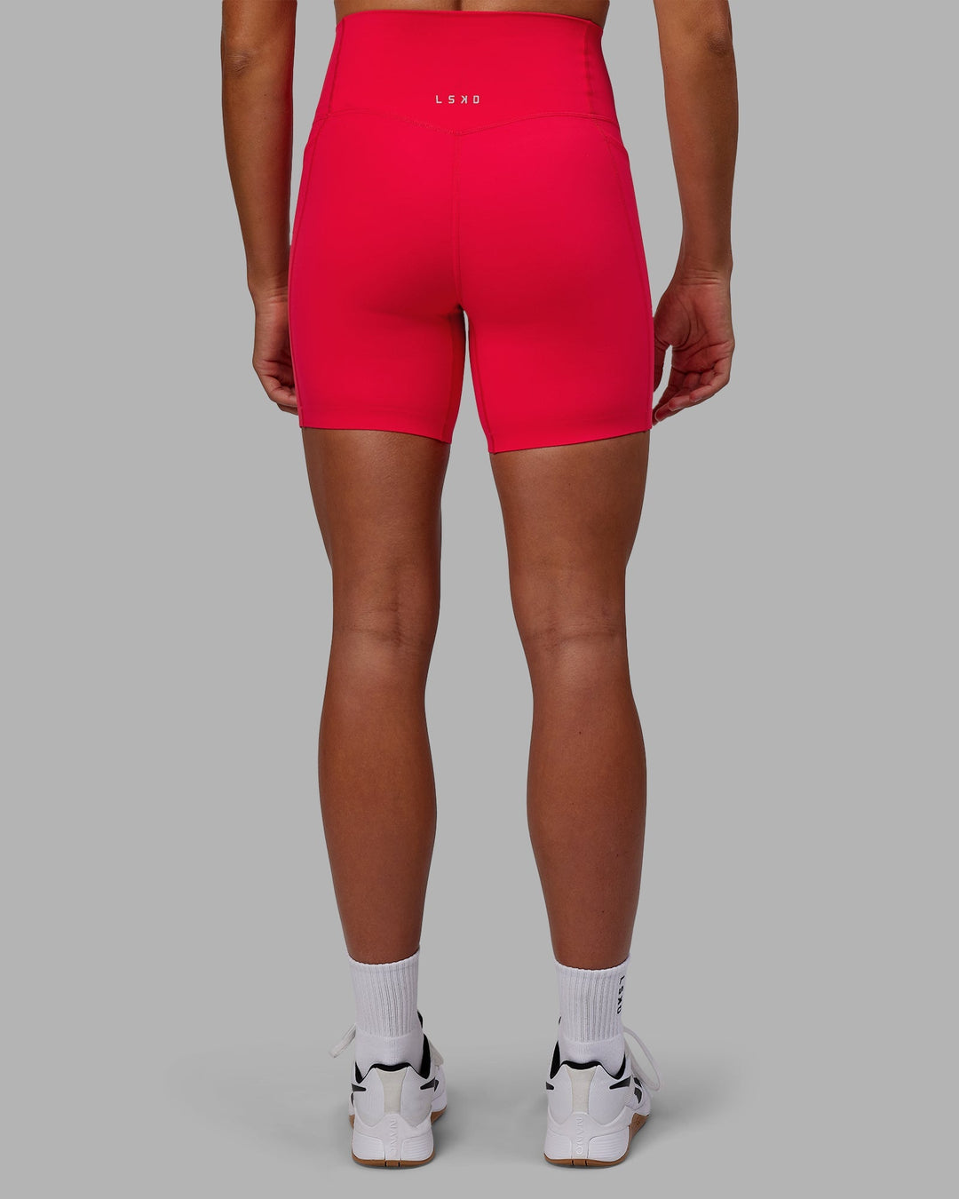 Woman wearing Elixir Mid-Length Shorts with Pockets - Scarlet