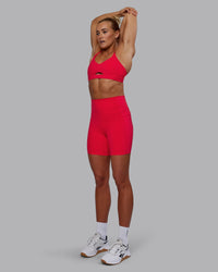 Woman wearing Elixir Ultra High-Rise 6" Short Pockets - Scarlet
