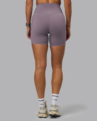 Woman wearing Elixir Ultra High-Rise 6" Short Pockets - Purple Sage