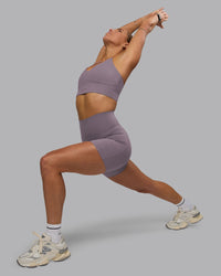 Woman wearing Elixir Ultra High-Rise 6" Short Pockets - Purple Sage