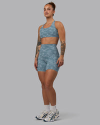 Woman wearing Elixir Ultra High-Rise 6" Short Pockets - Tranquil-Elemental Blue