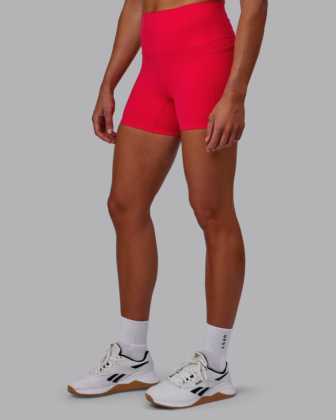 Woman wearing Elixir X-Length Shorts With Pockets - Scarlet