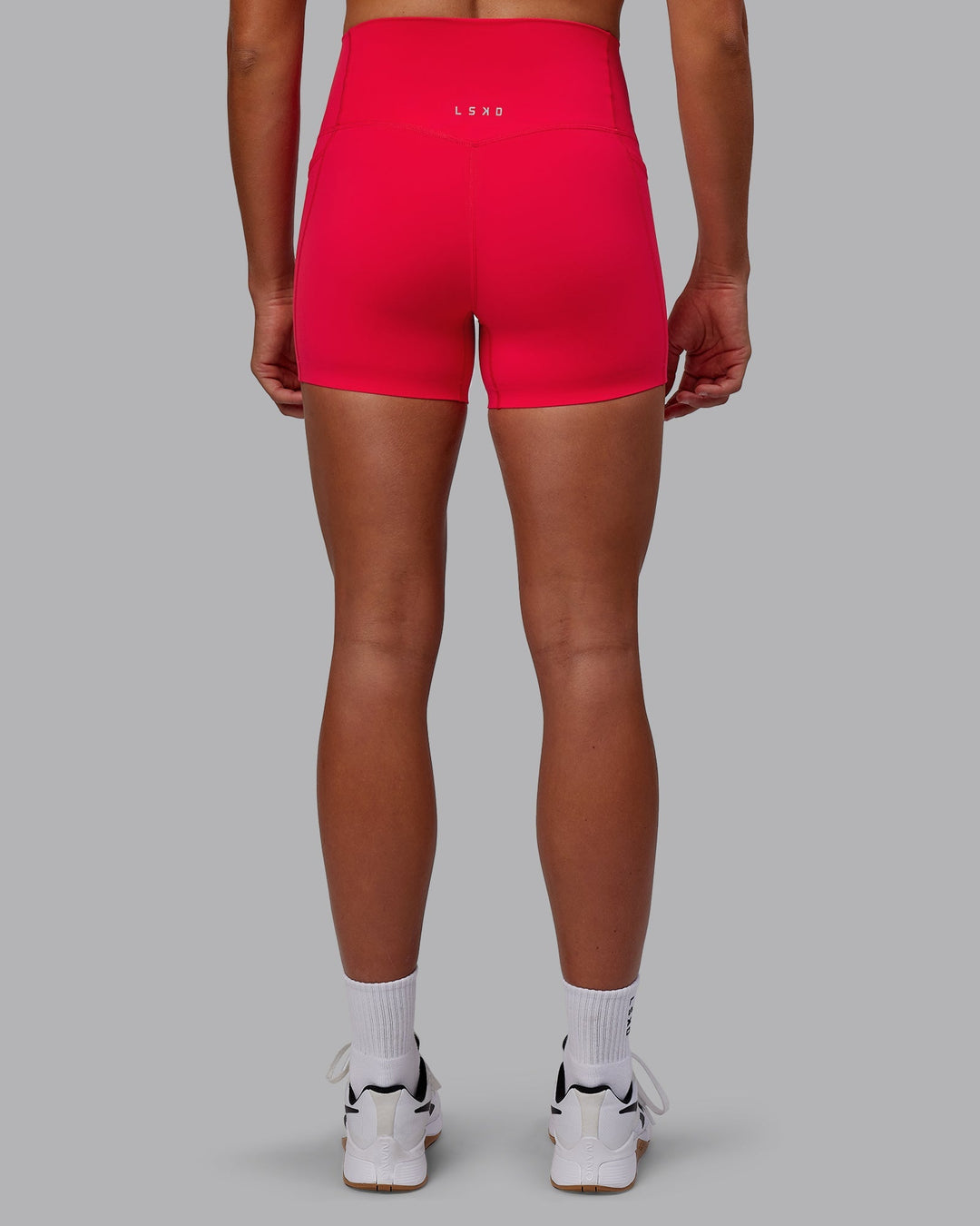 Woman wearing Elixir X-Length Shorts With Pockets - Scarlet