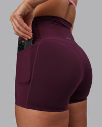 Woman wearing Elixir Ultra High-Rise 4" Short Pockets - Cherry Lacquer
