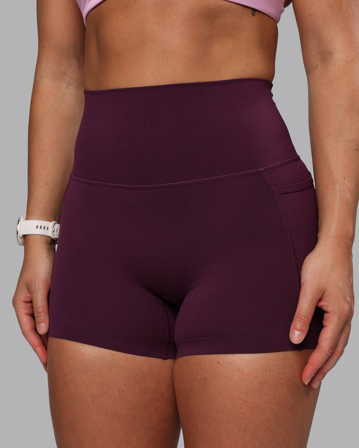 Woman wearing Elixir X-Short Tights With Pockets - Cherry Lacquer
