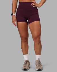 Woman wearing Elixir Ultra High-Rise 4" Short Pockets - Cherry Lacquer