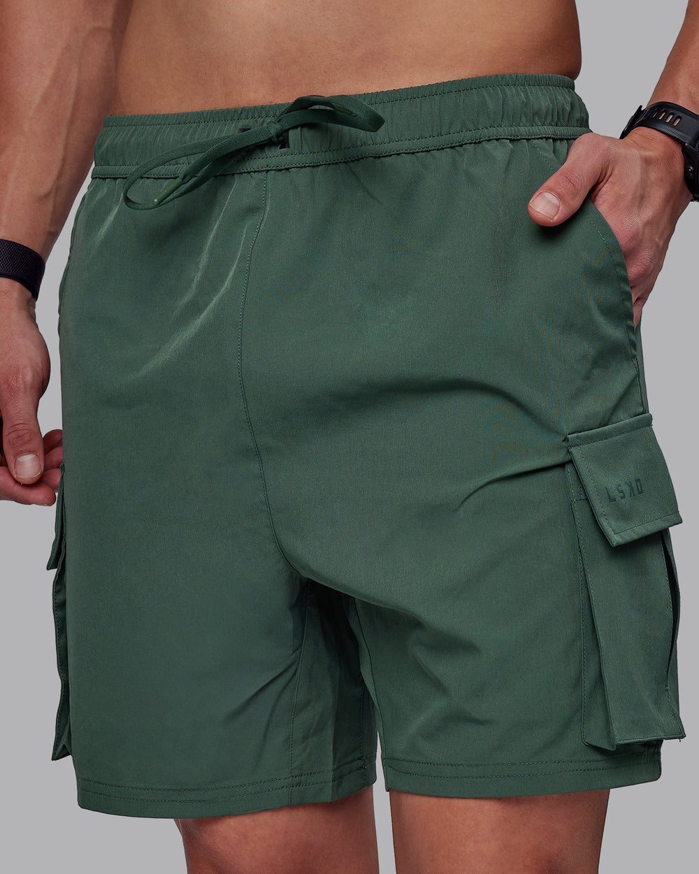 Man wearing Energy Stretch Performance Cargo Shorts - Cilantro